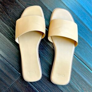 Beige leather slides. Lightly cushioned, size 6.